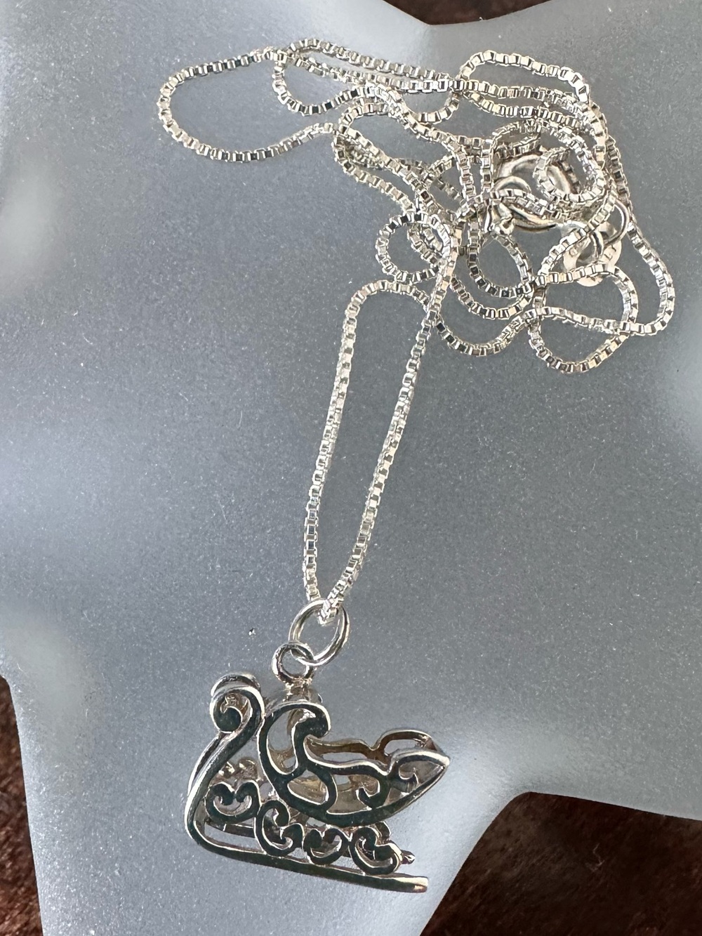 Sterling silver box chain with beautifully detailed sleigh charm